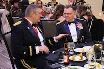 Brig. Gen. Lenny Williams speaks with Brig. Gen. Frederick Hockett  at the 33rd Infantry Brigade Combat Team Ball.