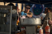 a man makes cotton candy