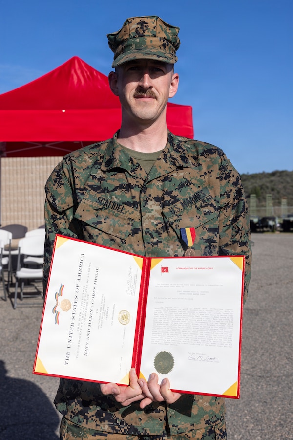 U.S. Marine Corps Staff Sgt. Billy Scafidel, an armory chief with 7th Engineer Support Battalion, 1st Marine Logistics Group, poses for a photo after being awarded a Navy and Marine Corps Medal on Marine Corps Base Camp Pendleton, California, Feb. 6, 2026, for his heroic actions of saving a Marine's life from a severe vehicle accident. Scafidel’s actions are an example of selflessness and valor, earning a Navy and Marine Corps Medal, the highest non-combat decoration awarded for heroism by the United States Department of the Navy to members of the United States Navy and United States Marine Corps. (U.S. Marine Corps photo by Sgt. Mary Torres)