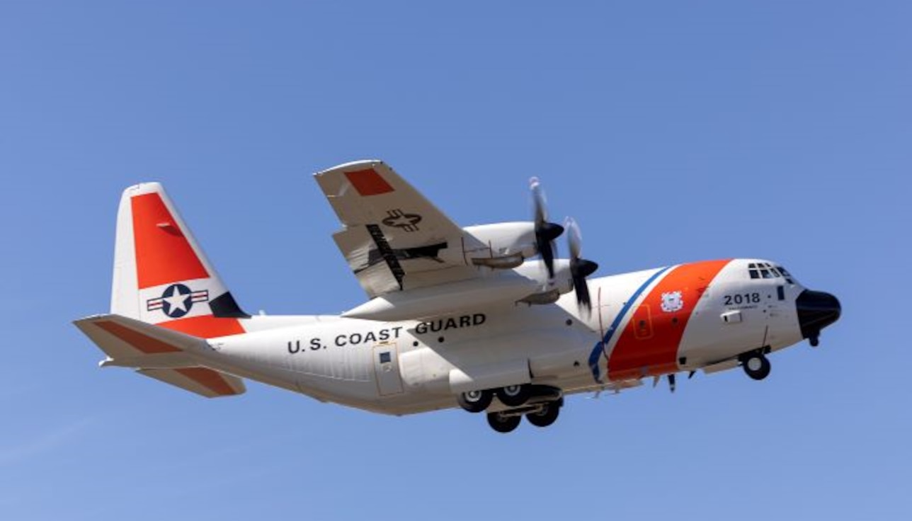 A Coast Guard HC-130J aircraft, designated CGNR 2018, flies through clear blue skies above Waco, Texas, while conducting flight testing following completion of integration of the Minotaur Mission System Suite.