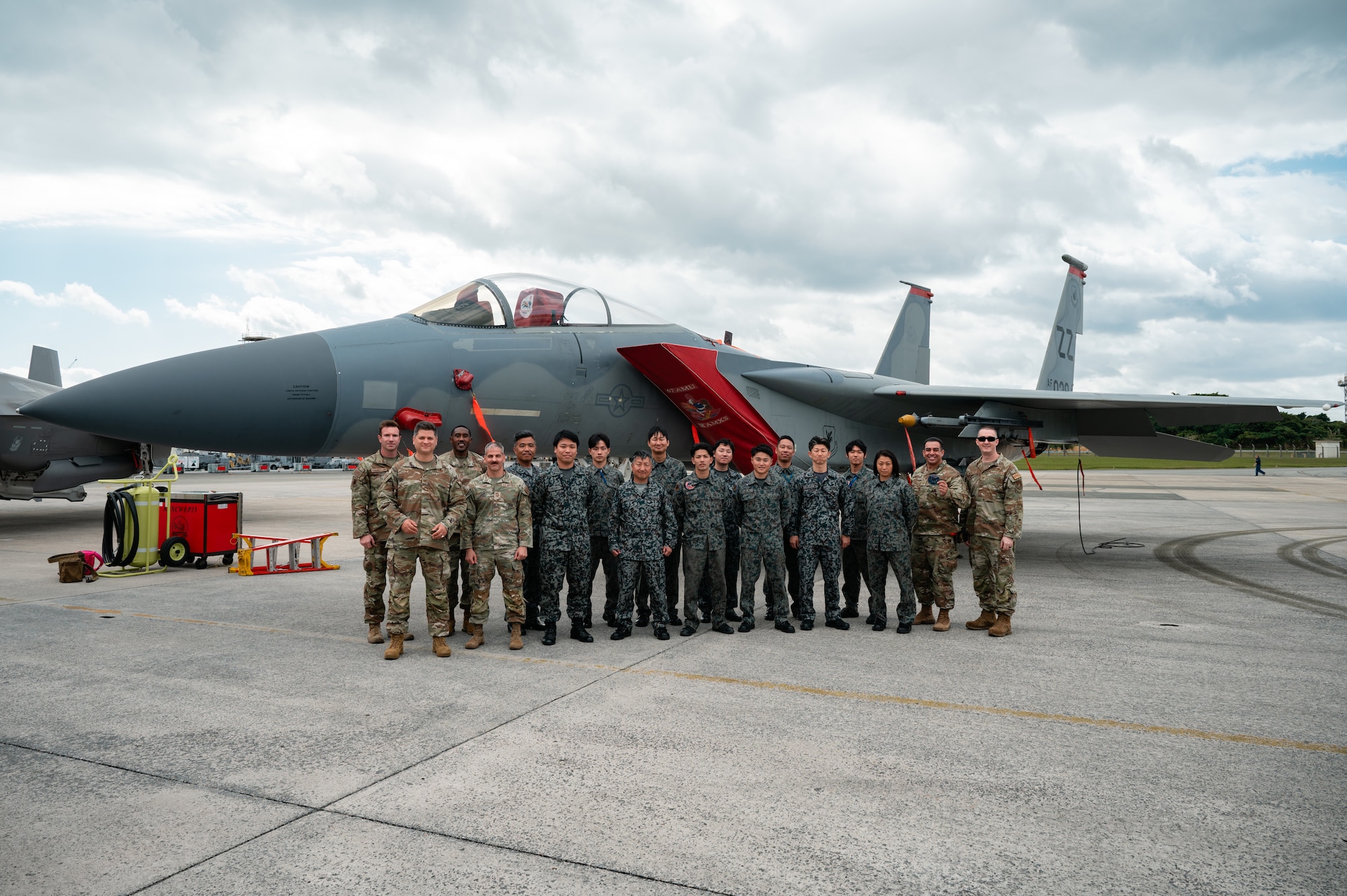 Members of the 18th Maintenance Group leadership team and members from the Japanese Air Self-Defense Force pose for a photo following the 18th Wing Load Crew of the Quarter Competition at Kadena Air Base, Japan, Jan. 30, 2026. This competition highlighted the importance load crews play in promoting deterrence and security throughout the Indo-Pacific region. (U.S. Air Force photo by Airman 1st Class Francisco Huerta)