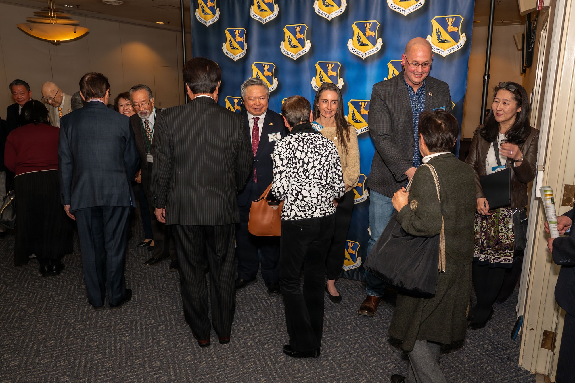 A group of people greeting in line