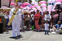 Musician 3rd Class Caleb Allen with the U.S. Naval Forces Europe and Africa Band (Topside Brass Band) plays at their performance at Caudan Waterfront (Umbrella Concert), Port Louis, Mauritius during Cutlass Express 2026 (CE 26).