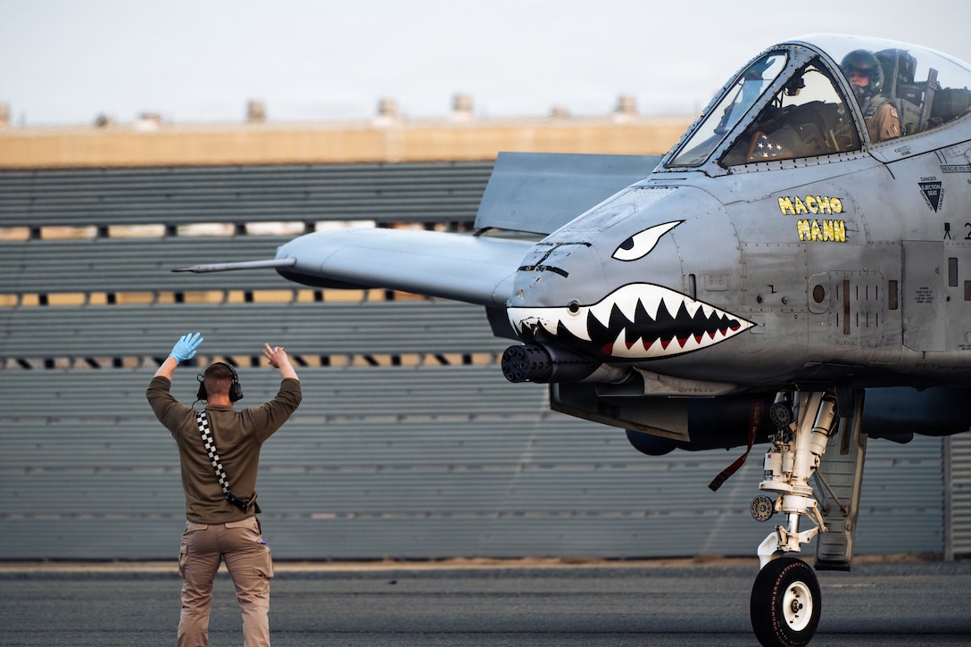 A U.S. Air Force 75th Expeditionary Fighter Generation Squadron crew chief marshals an A-10C Thunderbolt II aircraft at a base in the U.S. Central Command area of responsibility, Jan. 29, 2026. (U.S. Air Force photo by Staff Sgt. Tylin Rust)
