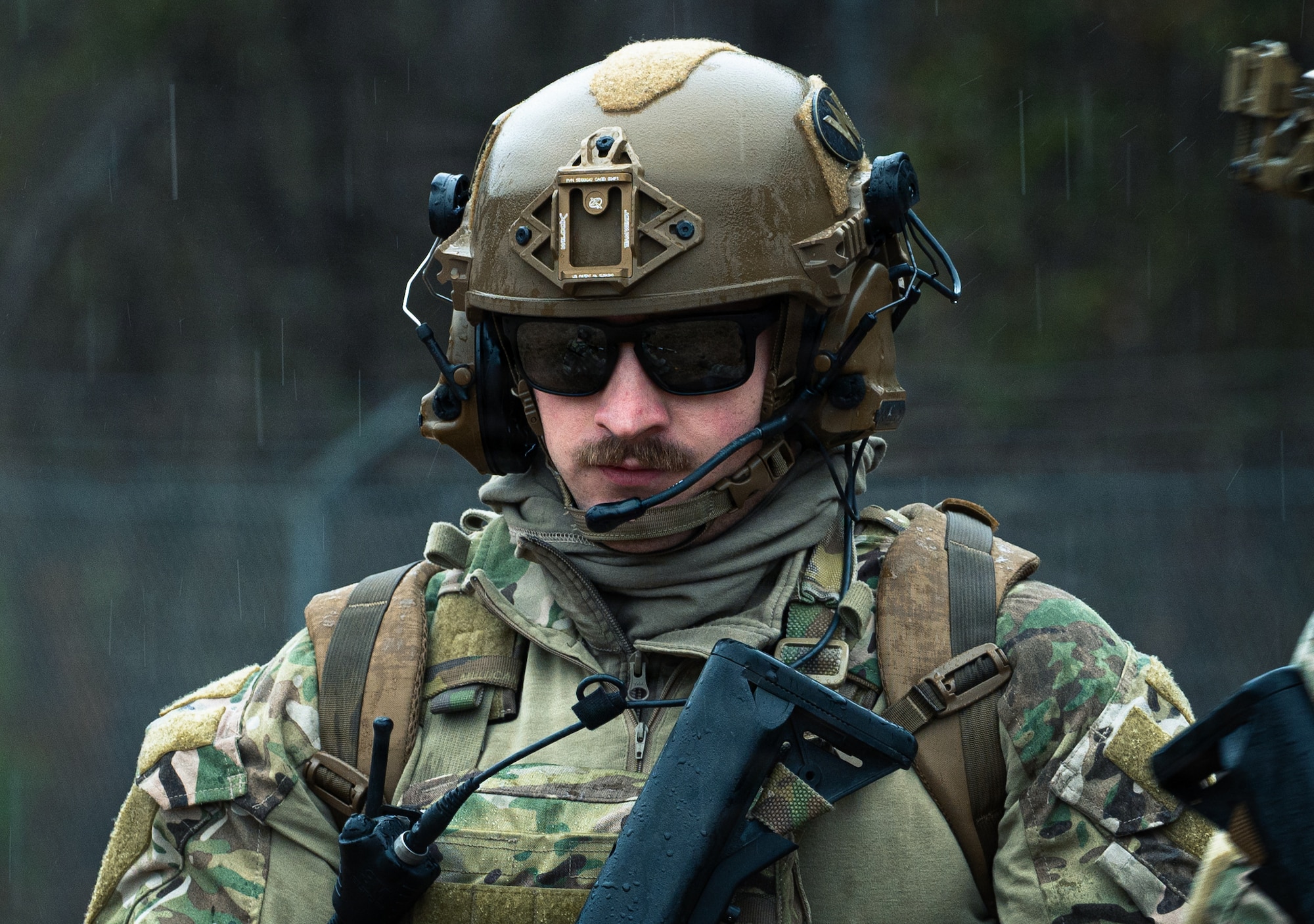 A U.S. Air Force Airman assigned to the 4th Civil Engineer Squadron, explosive ordnance disposal technician, scouts the area during a Field Training Exercise at Seymour Johnson Air Force Base, North Carolina, Jan. 22, 2026. The FTX was organized by Tech Sgt. Adam King to provide the airmen under his command with an opportunity to gain in-depth training on how EOD responds to real-world crises in hostile environments.  (U.S. Air Force photo by Airman First Class Holly Leonard)