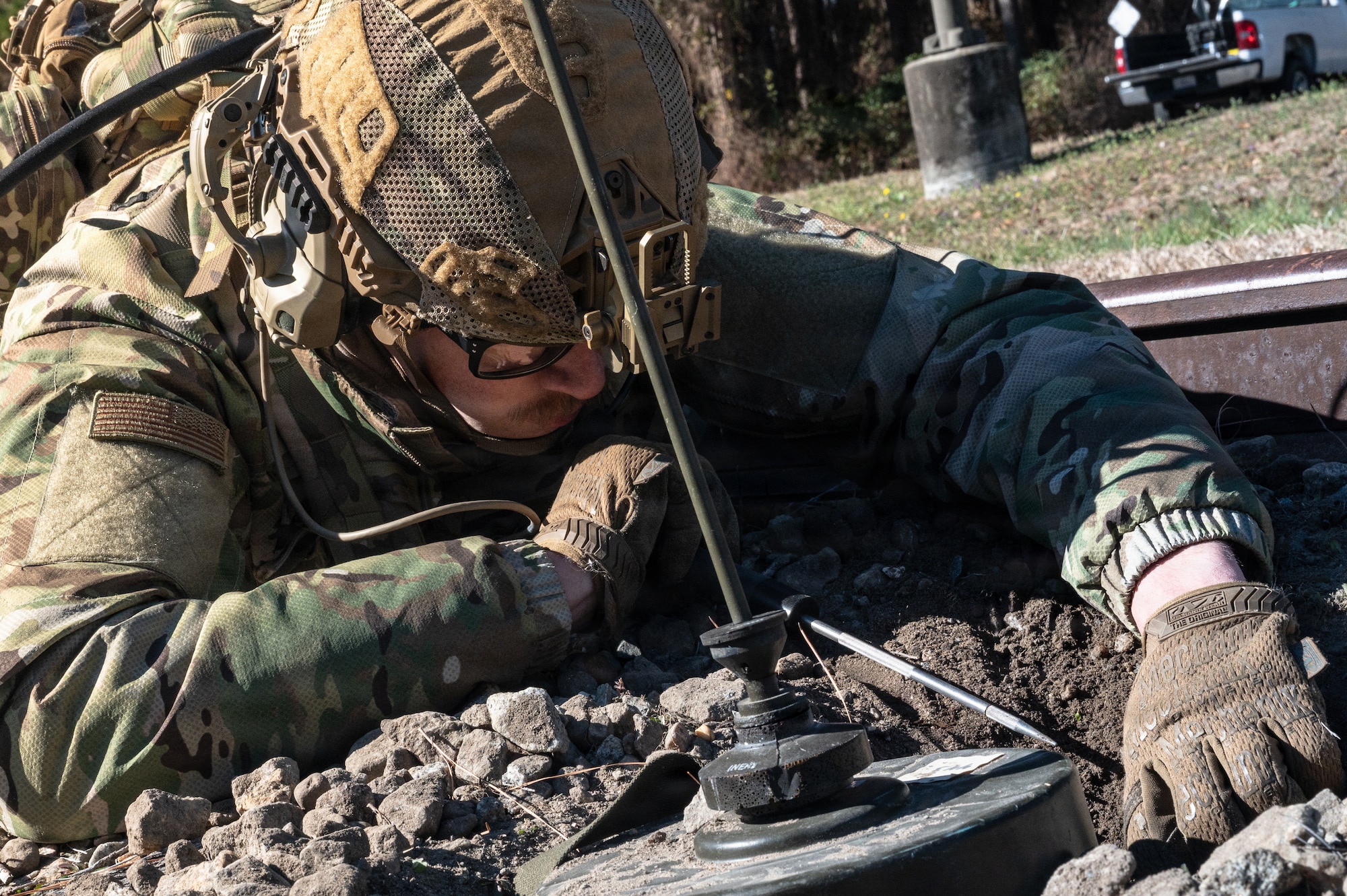 U.S. Air Force Staff Sgt. Ian Chromy, 4th Civil Engineer Squadron, explosive ordnance disposal technician, disengages a simulated tank mine during a Field Training Exercise at Seymour Johnson Air Force Base, North Carolina, Jan. 22, 2026. The FTX was organized by Tech Sgt. Adam King to provide the airmen under his command with an opportunity to gain in-depth training on how EOD responds to real-world crises in hostile environments. (U.S. Air Force photo by Airman First Class Holly Leonard)