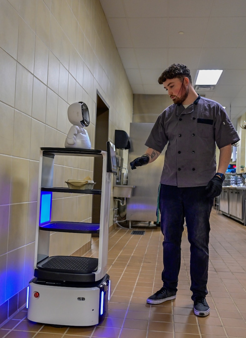 A robot gets programed to deliver lunch to DSCR employee. The robot is one of two recently rolled out by FMWR as part of pilot program.