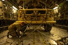 U.S. Air Force Airman 1st Class Andrew Stewart, 16th Expeditionary Airlift Squadron loadmaster, tightens a chain onboard a C-17 Globemaster III aircraft in the U.S. Central Command area of responsibility, Jan. 08, 2006. Stewart was deployed to provide the safe and efficient loading of cargo and personnel onboard the Globemaster throughout the CENTCOM AOR. (U.S. Air Force photo by Tech. Sgt. Nicholas Monteleone)