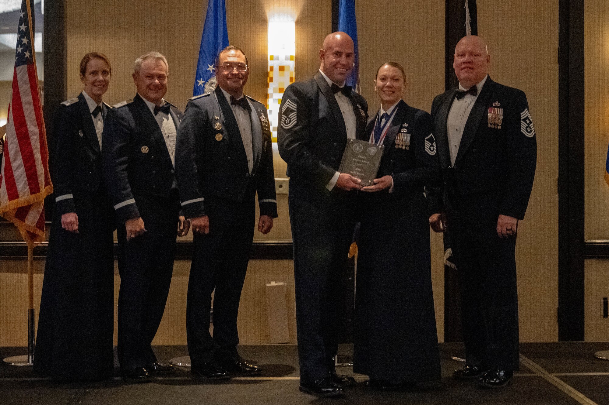 (From left) Maj. Gen. Jennie R. Johnson, Chief of Staff at Headquarters Air Force Reserve Command, Robins Air Force Base, Georgia, Brig. Gen. Craig McPike, Deputy Commander of the Air Force Recruiting Service, headquartered at Joint Base San Antonio-Randolph, Texas, Col. Sean “Metro” Fellows, 367th Recruiting Group commander, Robins AFB, Georgia, Chief Master Sgt. Derek Hudson, 367 RCG senior enlisted leader, Robins AFB, Georgia, Master Sgt. Heidi Pierce, Air Force Reserve recruiter, 350th Recruiting Squadron, Joint Base McGuire-Dix-Lakehurst, New Jersey, and Chief Master Sgt. Jeremy M. Allen, 10th Air Force Command Chief, Naval Air Station Fort Worth Joint Reserve Base, Texas, AFRC leadership, presents Pierce, the Chief’s Choice Award from 367 RCG leadership, during the Recruiting Training Event, Jan 29, 2026, in St. Louis, Missouri. The RTE held Jan 25-30, 2026, trains Air Force Reserve recruiters and celebrates recruiting accomplishments over FY25 after exceeding the AFR recruiting goal of 7,600 for a second consecutive year. (U.S. Air Force photo by Tech. Sgt. Della Creech)