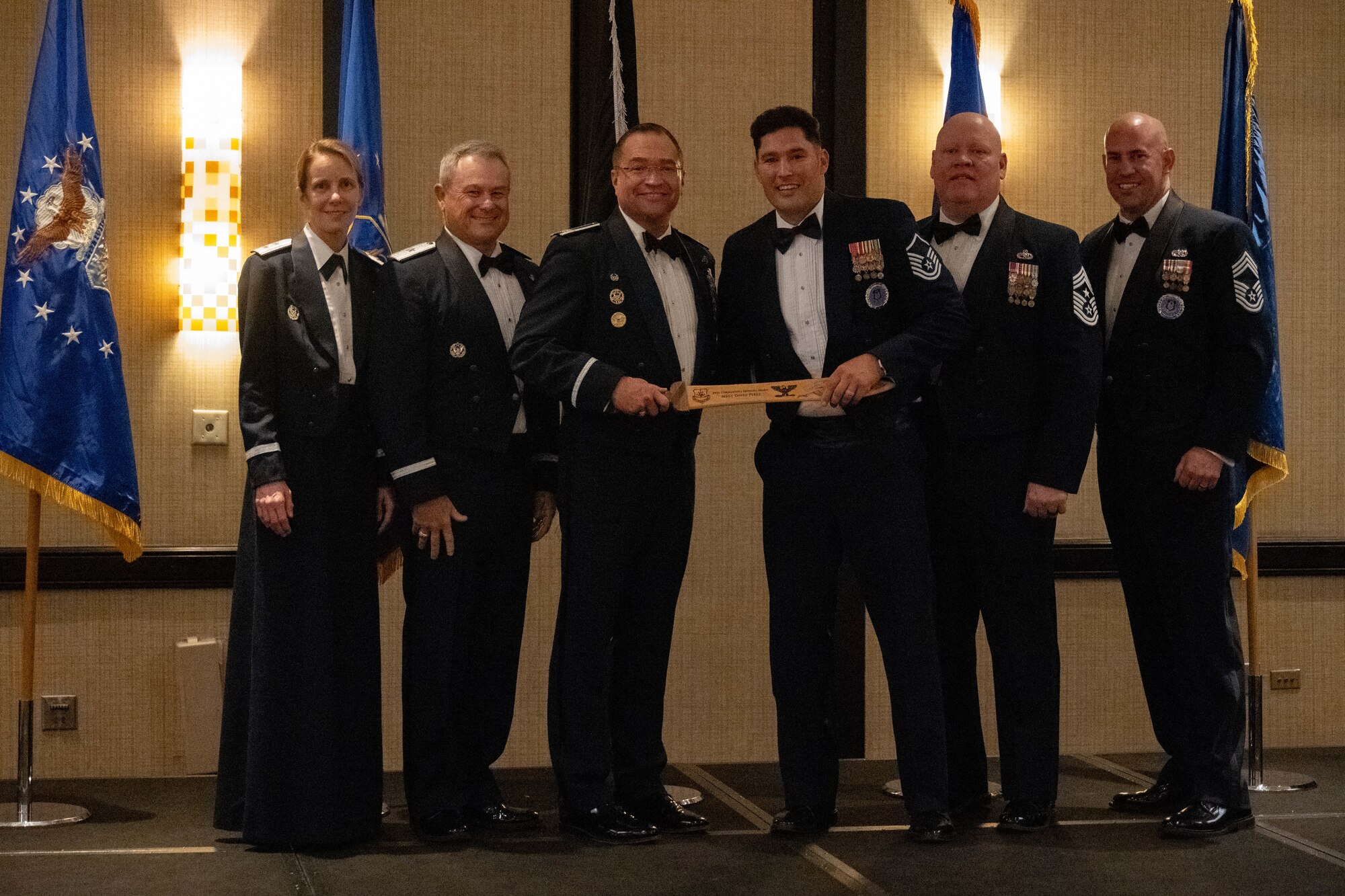 (From left) Maj. Gen. Jennie R. Johnson, Chief of Staff at Headquarters Air Force Reserve Command, Robins Air Force Base, Georgia, Brig. Gen. Craig McPike, Deputy Commander of the Air Force Recruiting Service, headquartered at Joint Base San Antonio-Randolph, Texas, Col. Sean “Metro” Fellows, 367th Recruiting Group commander, Robins AFB, Georgia, Master Sgt. David Perez, AFR recruiter, 353d Recruiting Squadron, March Air Reserve Base, California, Chief Master Sgt. Jeremy M. Allen, 10th Air Force Command Chief, Naval Air Station Fort Worth Joint Reserve Base, Texas, and Chief Master Sgt. Derek Hudson, 367 RCG senior enlisted leader, Robins AFB, Georgia, Air Force Reserve Command leadership, presents Perez, the Commander’s Choice Award from 367 RCG leadership, during the Recruiting Training Event, Jan 29, 2026, in St. Louis, Missouri. The RTE held Jan 25-30, 2026, trains Air Force Reserve recruiters and celebrated recruiting accomplishments over FY25 after exceeding the AFR recruiting goal of 7,600 for a second consecutive year. (U.S. Air Force photo by Tech. Sgt. Della Creech)