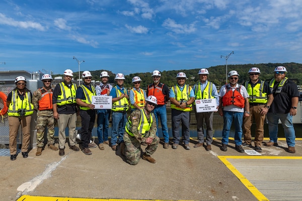 A group of people in construction gear pose for a photo.