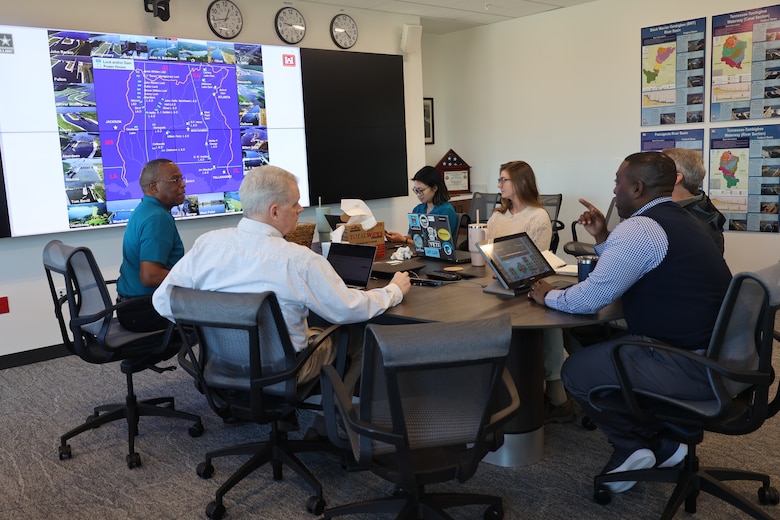 People sitting around a table for a meeting.