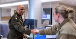 FORT BELVOIR, Va. (February 8, 2026)--Chaplain (Maj.) Scott Norman greets a staff member while making rounds at the A.T. Augusta Military Medical Center (ATAMMC) February 6, 2026.