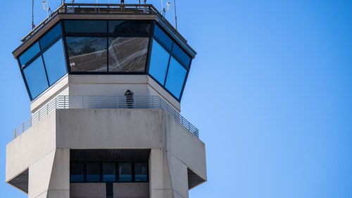 Airman use laser range finder to collect precise weather measurements on top of a tower