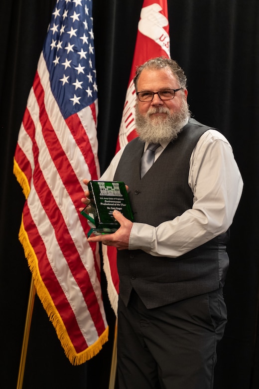 Dr. Cory Koger, Sacramento District senior chemist and water quality program manager, receives the Environmental Professional of the Year award Feb. 6 during the U.S. Army Corps of Engineers Sacramento District Annual Awards Ceremony. The national-level award recognizes more than 24 years of leadership in environmental cleanup, habitat restoration and emergency wildfire response.