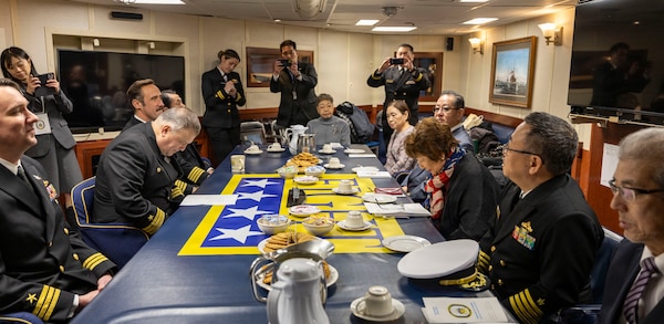 U.S. Navy Cmdr. Ivan Dobrev, commanding officer of Arleigh Burke-class guided-missile destroyer USS Dewey (DDG 105), left, hosts a meeting with Kumiko Okawa, chairwoman of Otaru Self-Defense Forces Supporters Association (SDFSA), right, and other members of SDFSA, in the ship’s wardroom during a port visit to Otaru, Japan, , Feb. 6, 2026. Dewey is forward-deployed and assigned to Destroyer Squadron (DESRON) 15, the Navy’s largest DESRON and the U.S. 7th Fleet’s principal surface force. U.S. 7th Fleet is the Navy’s largest forward-deployed numbered fleet, and routinely interacts and operates with allies and partners in preserving a free and open Indo-Pacific region. (U.S. Navy photo by Mass Communication Specialist 2nd Class Oscar Diaz)