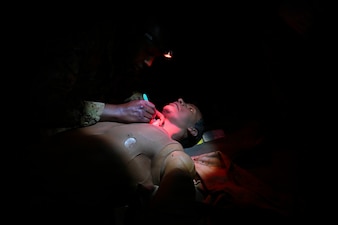 BETHESDA, Md. (Dec. 08, 2025) - Hospital Corpsman 3rd Class Philemon Kimutai, assigned Navy Medicine Readiness and Training Command (NMRTC) Bethesda, provides emergency care as part of the Tactical Combat Casualty Care (TCCC) Tier 1 course assessment. The testing marks the culmination of the 63-hour Combat Medic/Corpsman TCCC course, which prepares Navy corpsmen and other military medical personnel to deliver lifesaving trauma care in austere, forward-deployed, and combat environments. NMRTC Bethesda mission is to maximize warfighter performance through optimized medical readiness tailored to operational requirements; enhance the readiness of the medical force to sustain expeditionary medical capability; and train and develop the Navy Medicine Force. (U.S. Navy photo by Mass Communication Specialist 2nd Class Alec Kramer)