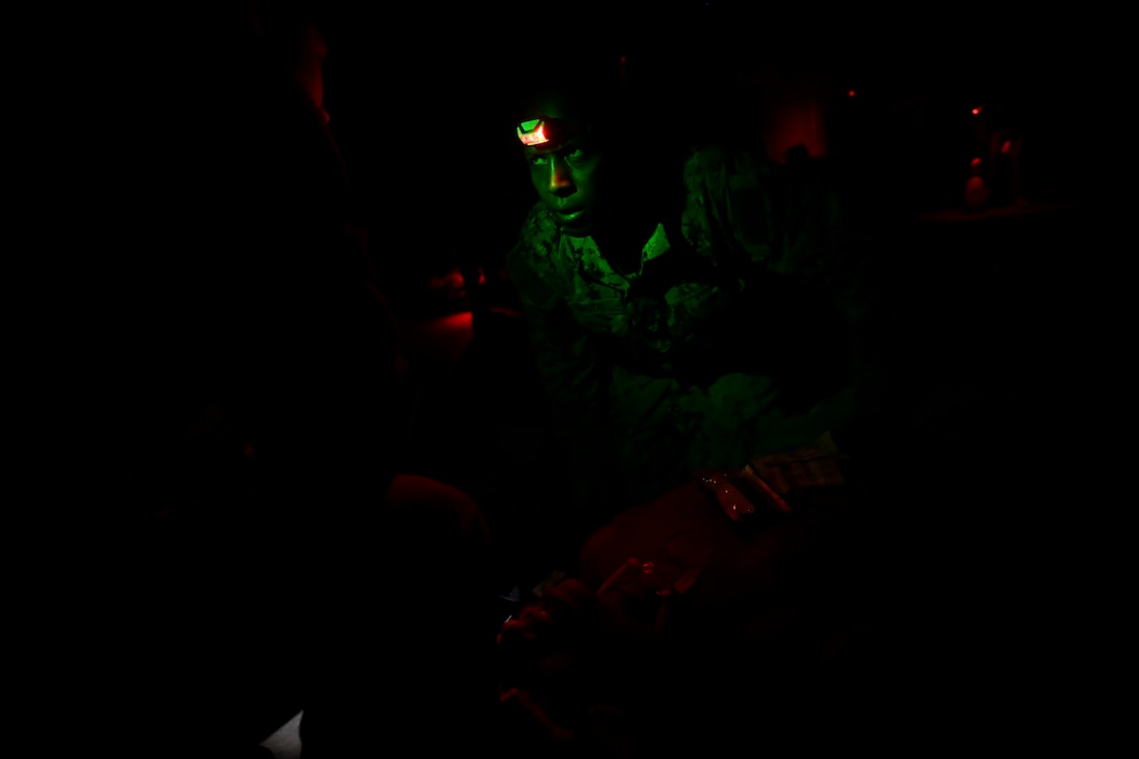 BETHESDA, Md. (Dec. 08, 2025) - Hospital Corpsman 3rd Class Philemon Kimutai, assigned Navy Medicine Readiness and Training Command (NMRTC) Bethesda, provides emergency care as part of the Tactical Combat Casualty Care (TCCC) Tier 1 course assessment. The testing marks the culmination of the 63-hour Combat Medic/Corpsman TCCC course, which prepares Navy corpsmen and other military medical personnel to deliver lifesaving trauma care in austere, forward-deployed, and combat environments. NMRTC Bethesda mission is to maximize warfighter performance through optimized medical readiness tailored to operational requirements; enhance the readiness of the medical force to sustain expeditionary medical capability; and train and develop the Navy Medicine Force. (U.S. Navy photo by Mass Communication Specialist 2nd Class Alec Kramer)