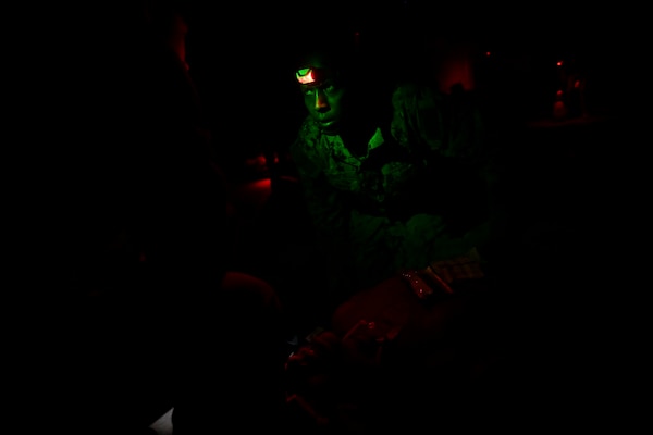 BETHESDA, Md. (Dec. 08, 2025) - Hospital Corpsman 3rd Class Philemon Kimutai, assigned Navy Medicine Readiness and Training Command (NMRTC) Bethesda, provides emergency care as part of the Tactical Combat Casualty Care (TCCC) Tier 1 course assessment. The testing marks the culmination of the 63-hour Combat Medic/Corpsman TCCC course, which prepares Navy corpsmen and other military medical personnel to deliver lifesaving trauma care in austere, forward-deployed, and combat environments. NMRTC Bethesda mission is to maximize warfighter performance through optimized medical readiness tailored to operational requirements; enhance the readiness of the medical force to sustain expeditionary medical capability; and train and develop the Navy Medicine Force. (U.S. Navy photo by Mass Communication Specialist 2nd Class Alec Kramer)