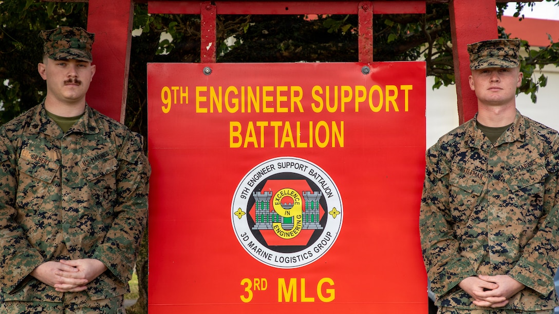 U.S. Marine Corps Sgt. Logan Gilbert, left, and Cpl. Gabriel Castleman, right, both combat engineers with 9th Engineer Support Battalion, 3rd Marine Logistics Group pose for a photo after participating in an interview on Camp Hansen, Okinawa, Japan, Jan. 23, 2026. Gilbert and Logan were being interviewed about assisting a local Japanese citizen during a medical emergency. (U.S. Marine Corps photo by Cpl. Eric Allen)