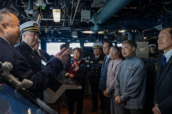 U.S. Navy Cmdr. Ivan Dobrev, commanding officer of Arleigh Burke-class guided-missile destroyer USS Dewey (DDG 105), center left, hosts a tour of the ship’s bridge for members of Otaru Self-Defense Forces Supporters Association (SDFSA), during a port visit to Otaru, Japan, Feb. 6, 2026. Dewey is forward-deployed and assigned to Destroyer Squadron (DESRON) 15, the Navy’s largest DESRON and the U.S. 7th Fleet’s principal surface force. U.S. 7th Fleet is the Navy’s largest forward-deployed numbered fleet, and routinely interacts and operates with allies and partners in preserving a free and open Indo-Pacific region. (U.S. Navy photo by Mass Communication Specialist 2nd Class Oscar Diaz)