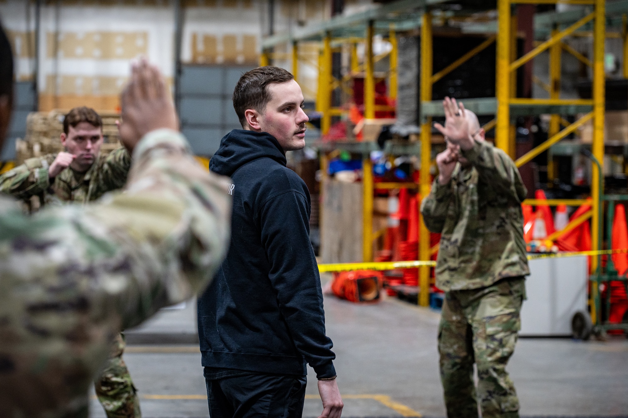 Airman 1st Class Joshua Jerome, 673d Security Forces Squadron basic combatives instructor, teaches a course during the Mission Ready Airman training portion of the Professional Development Center’s Noncommissioned Officer Foundation Course 500 at Joint Base Elmendorf-Richardson, Alaska, Feb. 6, 2026. The MRA training marks a first in Pacific Air Forces, giving foundation course students hands-on refreshers of core warfighting skills. (U.S. Air Force photo by Senior Airman Hunter Hites)