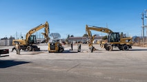 Construction equipment operates on concrete.