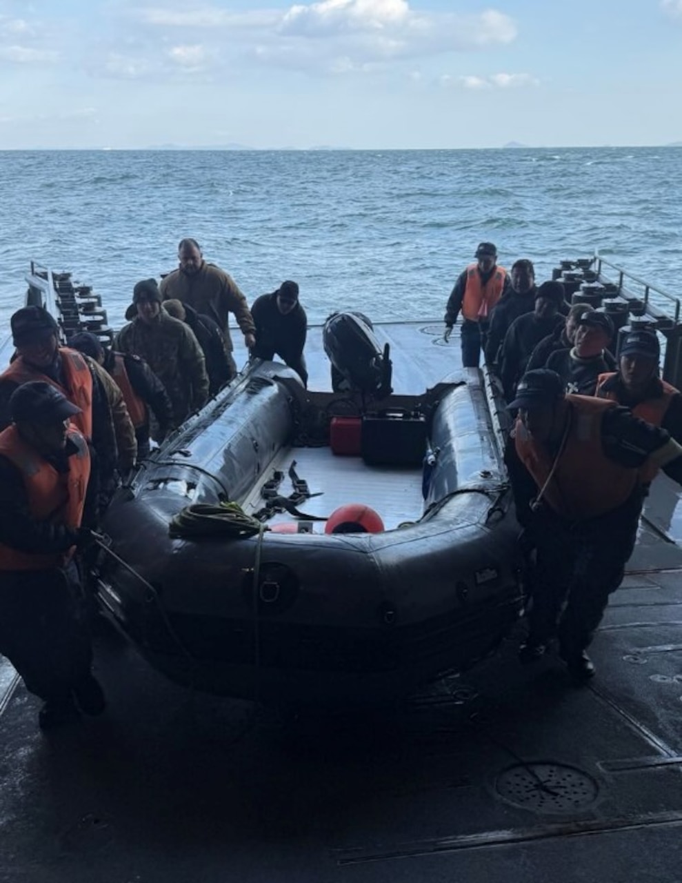 Sailors assigned to Explosive Ordnance Disposal Mobile Unit (EODMU) 5 and Japan Maritime Self-Defense Force (JMSDF) EOD teams return to the Uraga-class mine countermeasure vessel JS Bungo (MST-464) after completing unmanned underwater vehicle operations during Mine Warfare Exercise (MINEX) 1JA, Feb. 2, 2026. MINEX 1JA is part of a year-long series of bilateral exercise between the U.S. Navy and JMSDF to strengthen interoperability and increase proficiency in mine countermeasure operations. (U.S. Navy photo by Senior Chief Minemen Chris Gonzales Bouton)