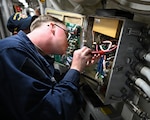 Cryptologic Technician (Technical) 3rd Class Daniel Golden performs maintenance on an electrical panel aboard Arleigh Burke-class guided-missile destroyer USS Pinckney (DDG 91), as part of ship repair and maintenance exercise at Changi Naval Base, Singapore, Jan. 27, 2026. Ship repair and maintenance exercise is designed to rehearse coordination and execution of ship damage repair from forward locations within the Indo-Pacific region, strengthening ties with the skilled workforce within allied and partner countries. A testament to the excellent and longstanding defense relationship between Singapore and the U.S. is the agreement allowing U.S. Navy ships to transit in Singapore for logistics and maintenance requirements. (U.S. Navy photo by Mass Communication Specialist 2nd Class Thomas Furnish)