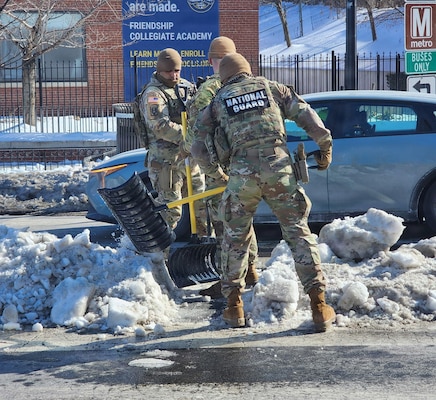 Oklahoma National Guardsmen deployed in support of the D.C. Safe and Beautiful mission as part of Task Force Thunder clear snow and ice from walkways around Washington, D.C., after Winter Storm Fern.