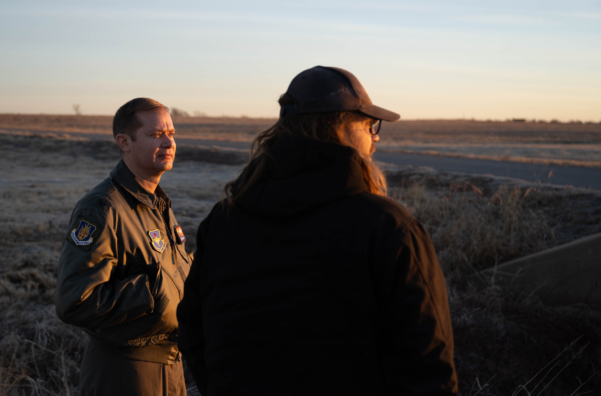 U.S. Air Force Col. Richard Kind, 97th Air Mobility Wing commander, left, talks with Mitchell Singer, U.S. Department of Agriculture (USDA) wildlife biologist, right, at Altus Air Force Base (AFB), Oklahoma, Feb. 5, 2026. Singer discussed the USDA’s execution of the Bird/Wildlife Aircraft Strike Hazard program, the goal of which is to minimize local and transient aircraft exposure to potentially hazardous bird/animal strikes at or near Altus AFB. (U.S. Air Force photo by Airman 1st Class Emma Wright)