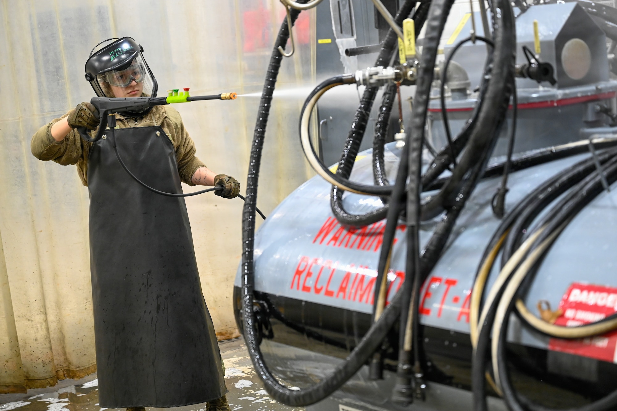 Airman cleans equipment