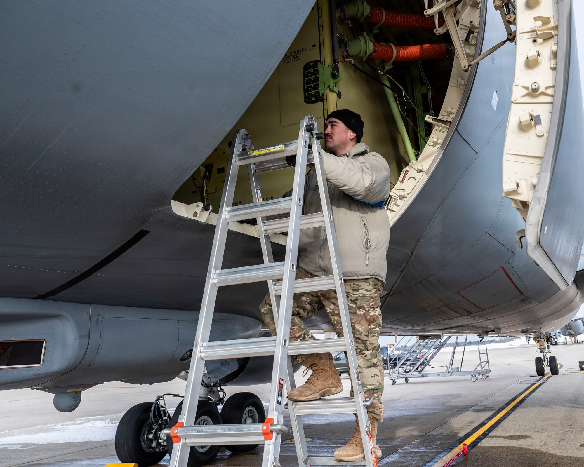Maintainer works on aircraft