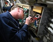 Cryptologic Technician (Technical) 3rd Class Daniel Golden performs maintenance on an electrical panel aboard Arleigh Burke-class guided-missile destroyer USS Pinckney (DDG 91), as part of ship repair and maintenance exercise at Changi Naval Base, Singapore, Jan. 27, 2026. Ship repair and maintenance exercise is designed to rehearse coordination and execution of ship damage repair from forward locations within the Indo-Pacific region, strengthening ties with the skilled workforce within allied and partner countries. A testament to the excellent and longstanding defense relationship between Singapore and the U.S. is the agreement allowing U.S. Navy ships to transit in Singapore for logistics and maintenance requirements. (U.S. Navy photo by Mass Communication Specialist 2nd Class Thomas Furnish)