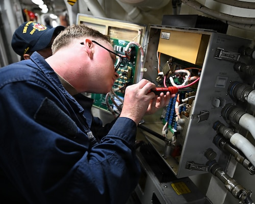 Cryptologic Technician (Technical) 3rd Class Daniel Golden performs maintenance on an electrical panel aboard Arleigh Burke-class guided-missile destroyer USS Pinckney (DDG 91), as part of ship repair and maintenance exercise at Changi Naval Base, Singapore, Jan. 27, 2026. Ship repair and maintenance exercise is designed to rehearse coordination and execution of ship damage repair from forward locations within the Indo-Pacific region, strengthening ties with the skilled workforce within allied and partner countries. A testament to the excellent and longstanding defense relationship between Singapore and the U.S. is the agreement allowing U.S. Navy ships to transit in Singapore for logistics and maintenance requirements. (U.S. Navy photo by Mass Communication Specialist 2nd Class Thomas Furnish)