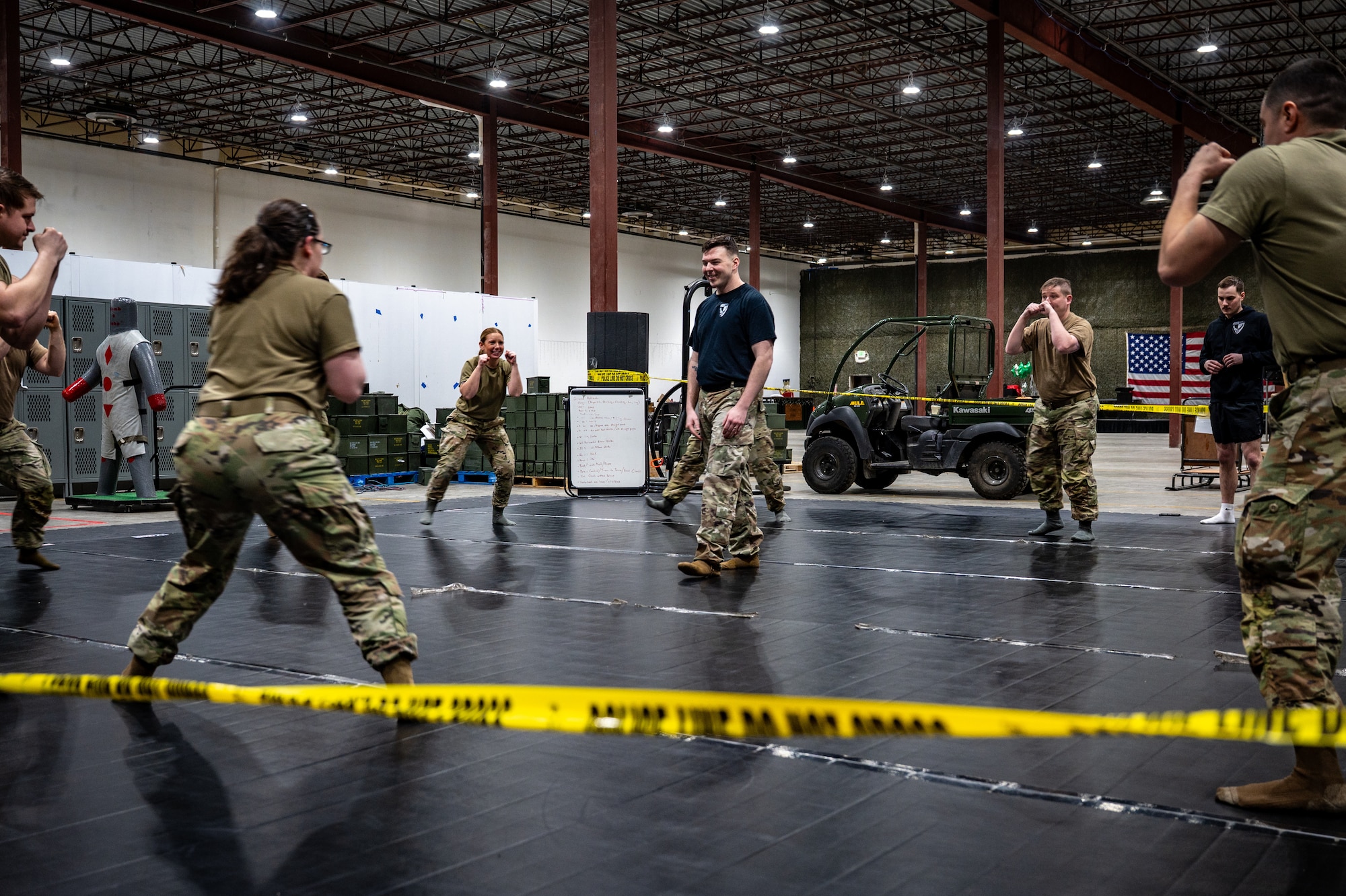 U.S. Air Force Staff Sgt. Ross Gearhart, center, 673d Security Forces Squadron senior combatives instructor, teaches a course during the Mission Ready Airman training portion of the Professional Development Center’s Noncommissioned Officer Foundation Course 500 at Joint Base Elmendorf-Richardson, Alaska, Feb. 6, 2026. As the first program of its kind within Pacific Air Forces, MRA training reinforces warfighting skills for junior enlisted, NCO and Senior NCO students. (U.S. Air Force photo by Senior Airman Hunter Hites)