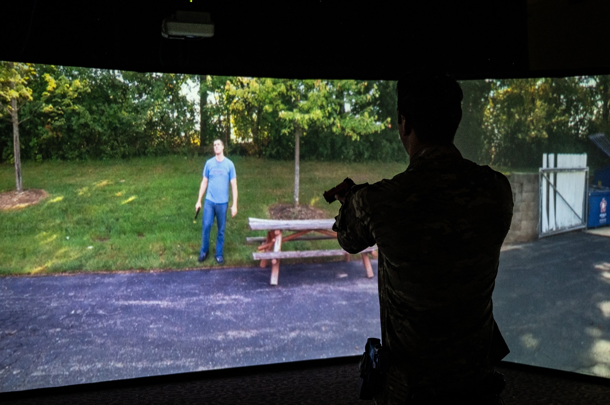 U.S. Air Force Tech. Sgt. Vincent Ruiz, 673d Logistics Readiness Squadron noncommissioned officer in charge of heavy equipment, practices in a law enforcement virtual reality training simulator during the Mission Ready Airman training portion of the Professional Development Center’s Noncommissioned Officer Foundation Course 500 at Joint Base Elmendorf-Richardson, Alaska, Feb. 6, 2026. The training simulator allows users to practice use-of-force in virtual reality. The MRA training is the first in Pacific Air Forces, allowing foundation course students to refresh their knowledge of warfighting skills, such as combatives, land navigation, use-of-force and land mobile radio systems. (U.S. Air Force photo by Senior Airman Hunter Hites)