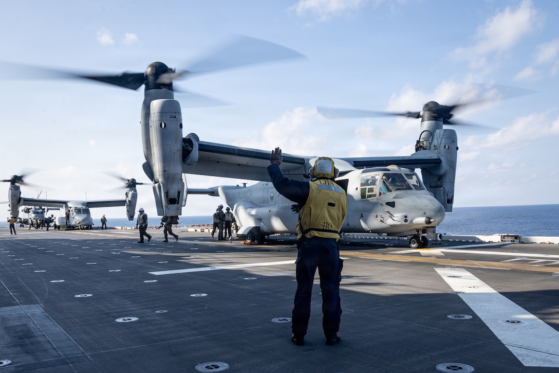 U.S. Marines with Maritime Raid Force, 31st Marine Expeditionary Unit, prepare to depart the amphibious assault ship USS Tripoli (LHA 7), in an MV-22B Osprey aircraft assigned to Medium Marine Tiltrotor Squadron (VMM) 265 (Rein.), in order to conduct a simulated Visit, Board, Search and Seizure exercise in the Philippine Sea, Feb. 4, 2026.