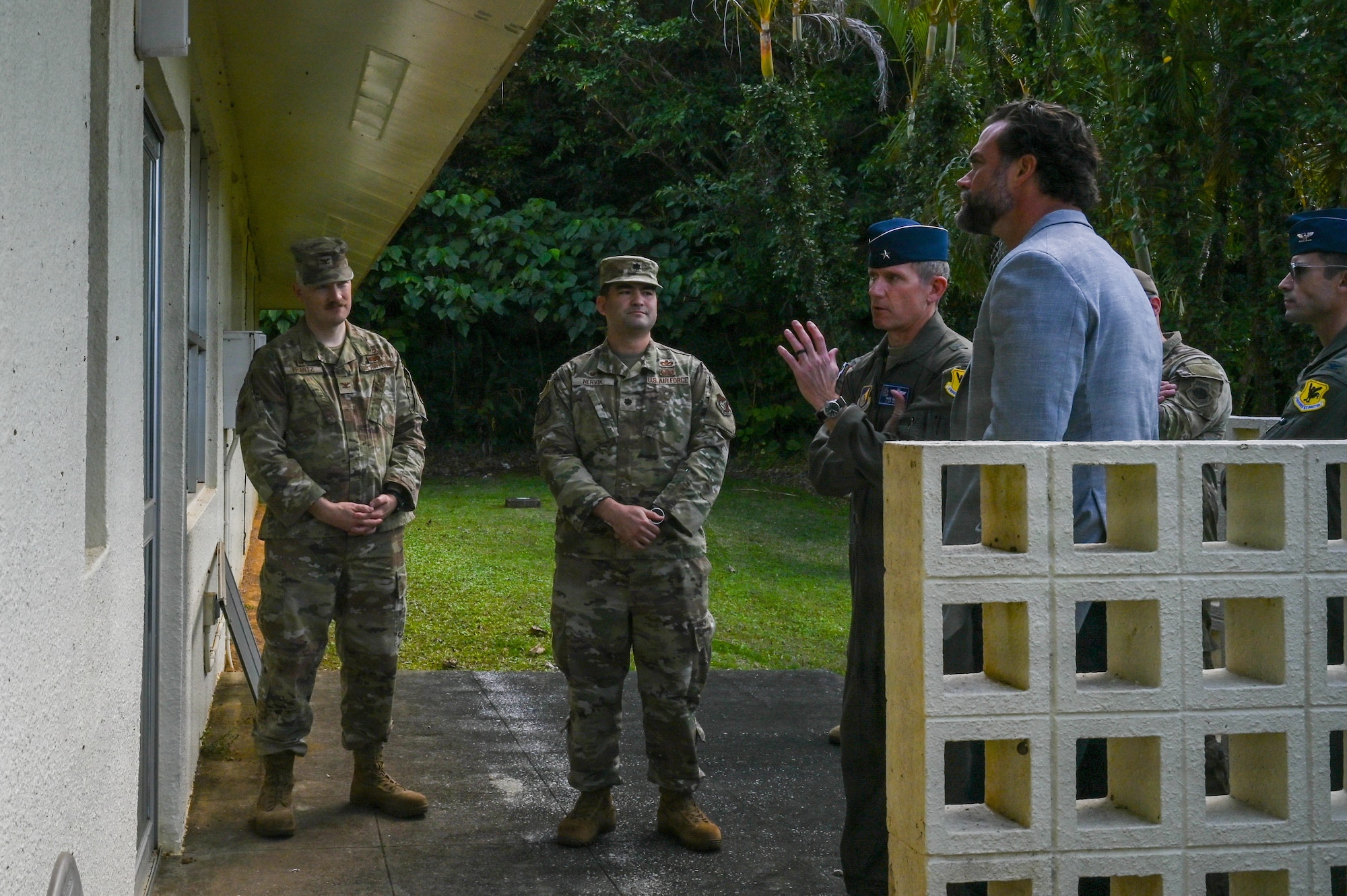 Service members brief government official.