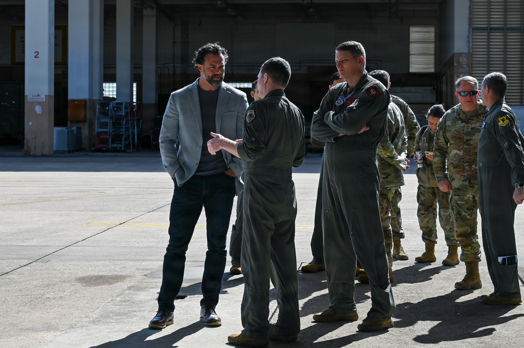 Service members brief government officials.