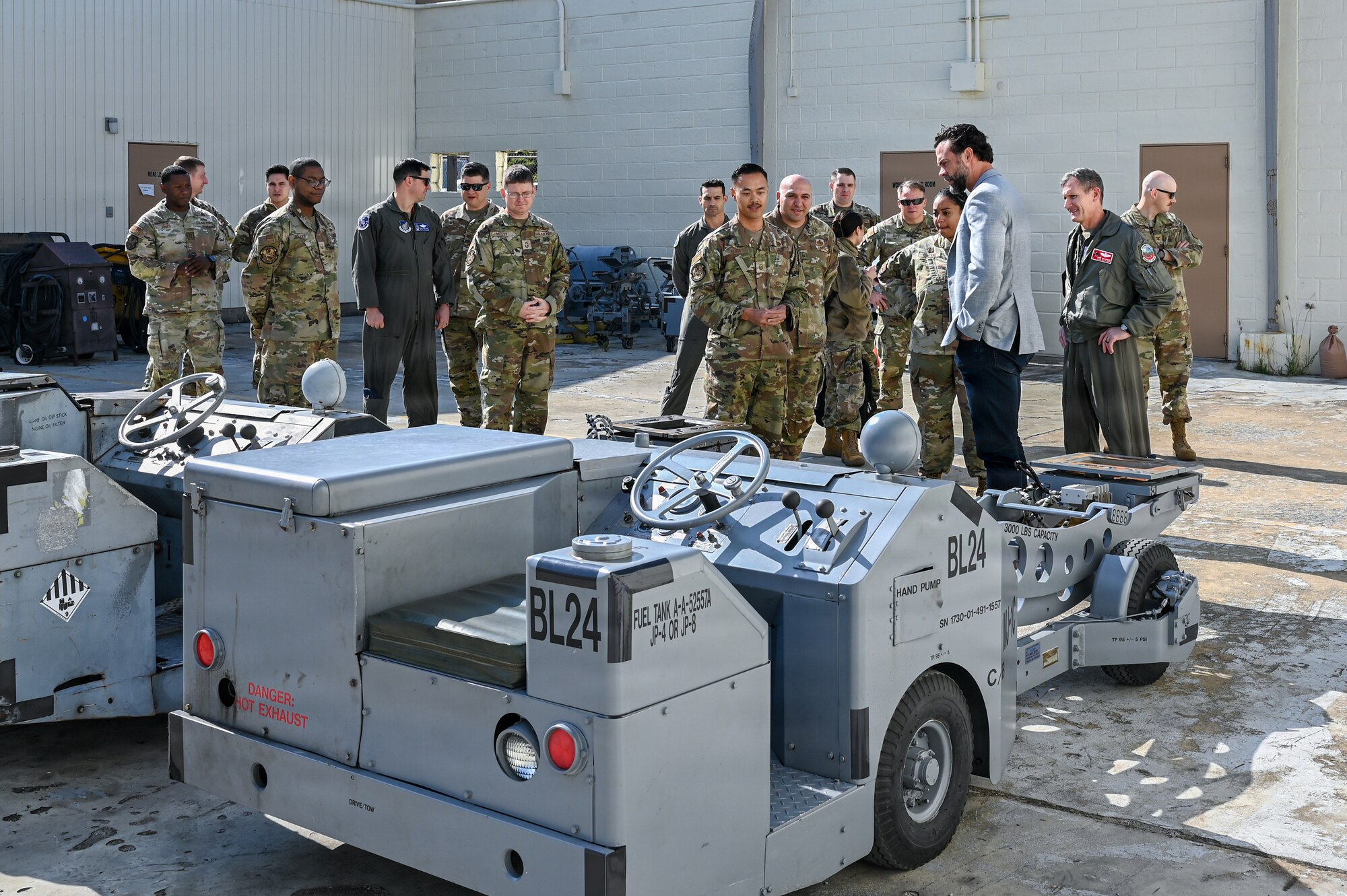 Service members brief government official.