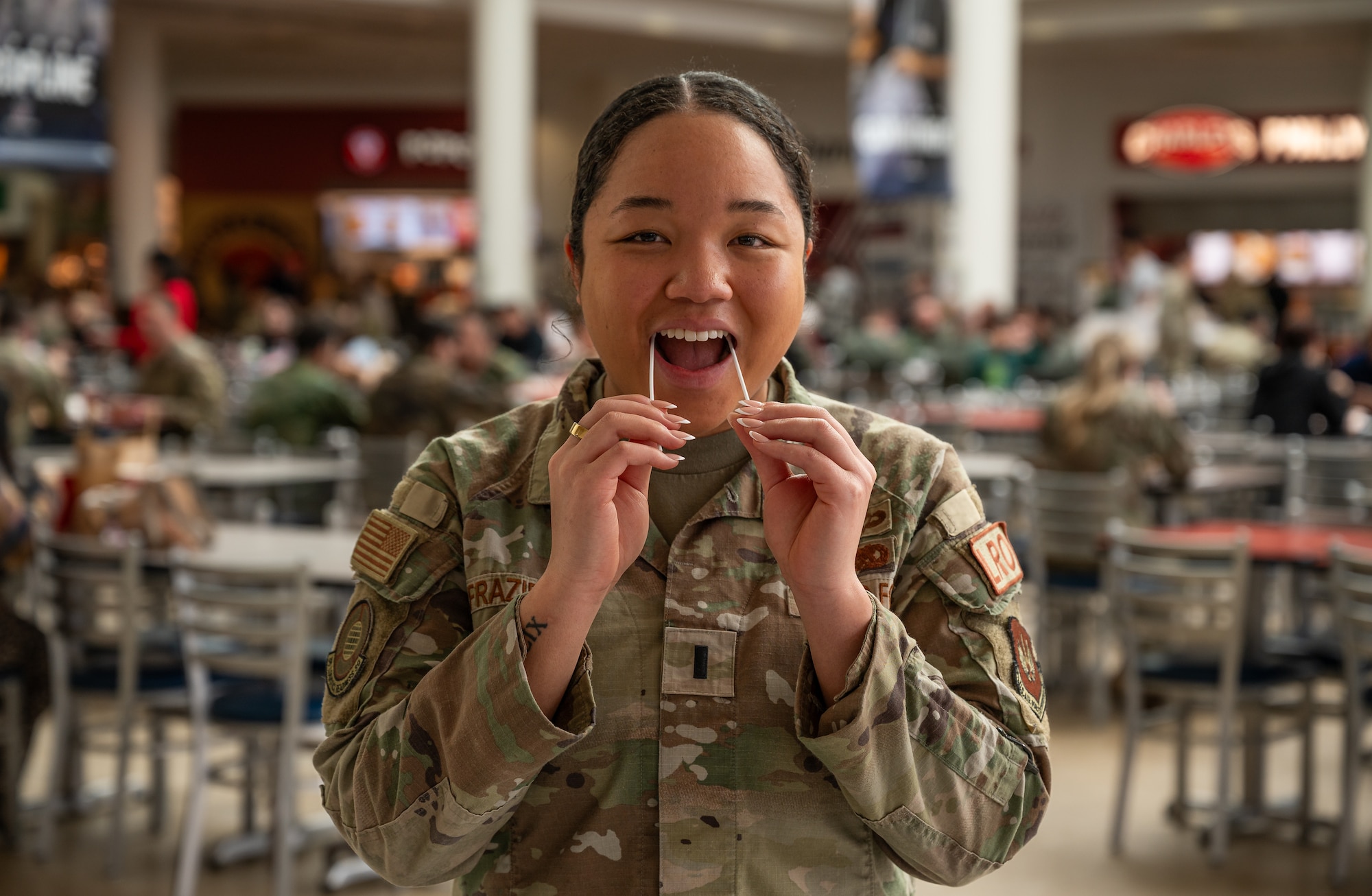 U.S. Air Force 1st Lt. Ira Frazier, 86th Logistics Readiness Squadron military installation deployment officer, performs a mouth swab on herself during a Salute to Life Program registration at Ramstein Air Base, Germany, Feb. 10, 2026. Participants completed self-administered cheek swabs used to determine human leukocyte antigen typing for potential future bone marrow or stem cell donation. Salute to Life is a Department of War authorized program operating in partnership with the National Marrow Donor Program to support patients in need of transplants. (U.S. Air Force photo by Senior Airman Jared Lovett)