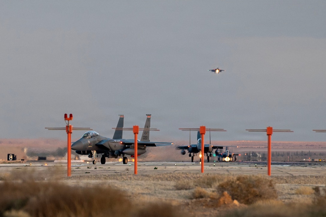 U.S. Air Force F-15E Strike Eagle aircraft taxi off of the runway after landing at a base in the Middle East, Jan. 18, 2026. The U.S. maintains a highly agile fighting force, leveraging the most advanced capabilities to support the long-term security and stability of the region. (U.S. Air Force photo by Senior Airman Jared Brewer)