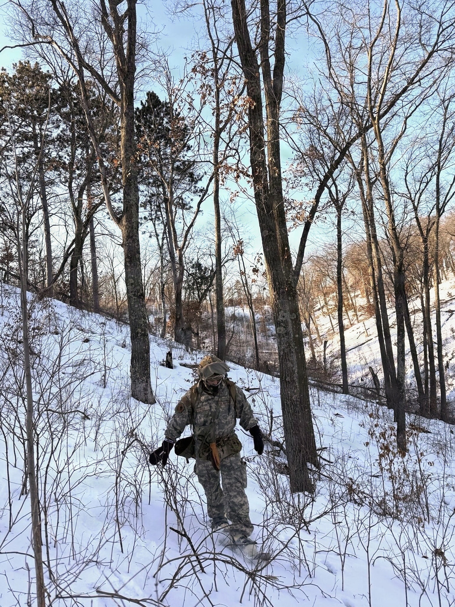Airman walks through the snow.