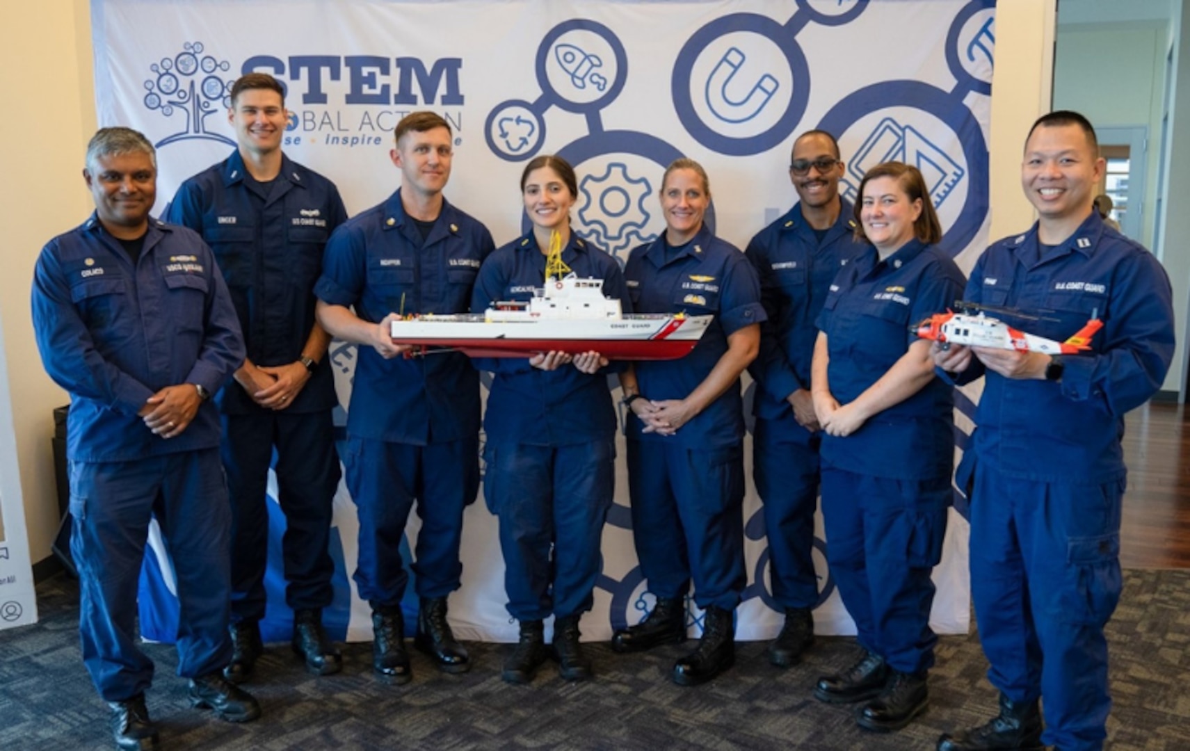 PIE Program volunteers from Coast Guard Sector Houston-Galveston a 2025 PIE Award winner at USCG STEM NOLA Buoyancy & Density Workshop at San Jacinto College Maritime Campus, LaPorte, TX. From left to right: AUX Glenn A. Colaco, LTJG Thomas D. Unger, MST1 (now ENS) Brandon R. Nidiffer, ENS (now LTJG) Catarina L. Goncalves, MCPO Jenell D. Kindregan, ENS (now LTJG) Zachary O. Broomfield, CDR Kelly M. Brown, and LT Phung P. Pham. Photo taken by STEM NOLA photographer.
