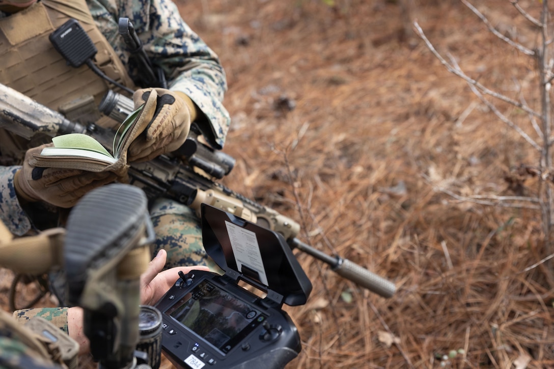 U.S. Marine Corps Lance Cpl. Steven Salcedo Jr., an infantry rifleman and a small unmanned aircraft system operator with 1st Battalion, 2nd Marine Regiment, 2nd Marine Division, observes the flight patterns of a Skydio X2D Small Unmanned Aircraft System during a simulated squad attack on Marine Corps Base Camp Lejeune, North Carolina, Jan. 22, 2026. The live fire drone attack exercise was held to demonstrate the integration of the NEROS Archer, a newly introduced first-person view drone employed by the Department of War, with infantry Marines. (U.S. Marine Corps photo by Lance Cpl. Isabelle Hutmacher)