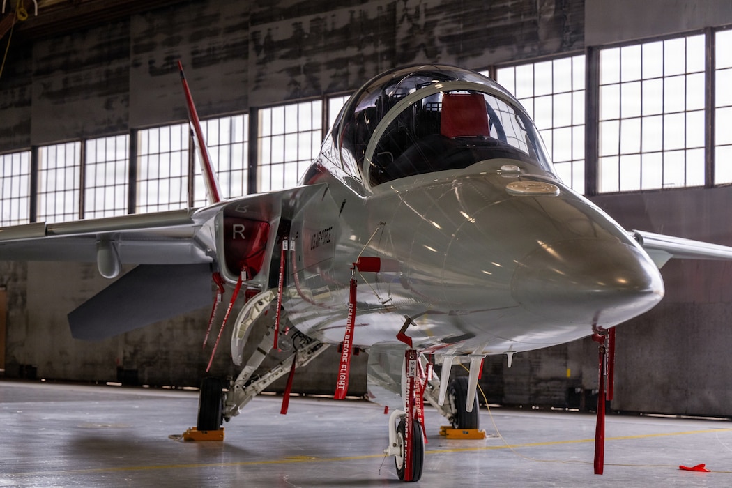 A T-7A Red Hawk sits in a hangar