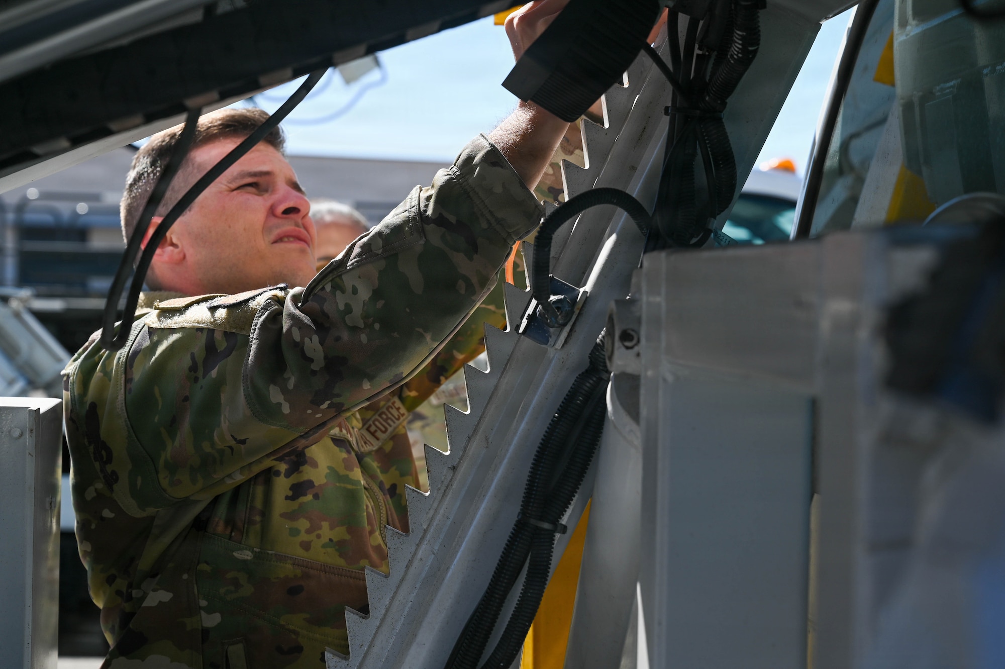U.S. Air Force Staff Sgt. Joseph Griffith, 45th Logistics Readiness Squadron air terminal operations supervisor, inspects malfunctioning lock on the staircase truck at Patrick Space Force Base, Florida, Jan. 28, 2026. Routine inspections help ensure ground support equipment remains safe, functional, and ready to support airlift operations. (U.S. Space force photo by Staff Sgt. Samuel Becker)