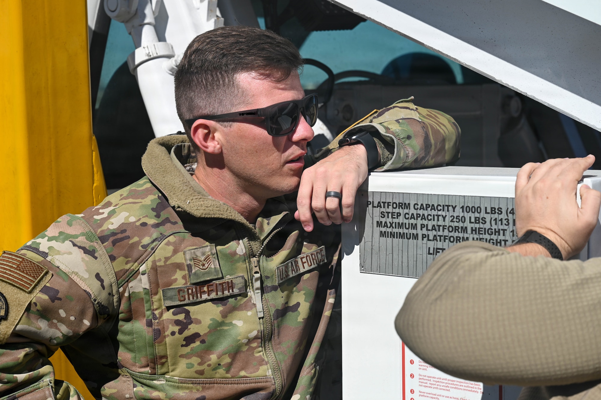 U.S. Air Force Staff Sgt. Joseph Griffith, 45th Logistics Readiness Squadron air terminal operations supervisor, supervises maintenance on a staircase truck at Patrick Space Force Base, Florida, Jan. 28, 2026. Supervising maintenance helps ensure ground support equipment remains safe and ready to support air terminal operations. (U.S. Space Force photo by Staff Sgt. Samuel Becker)