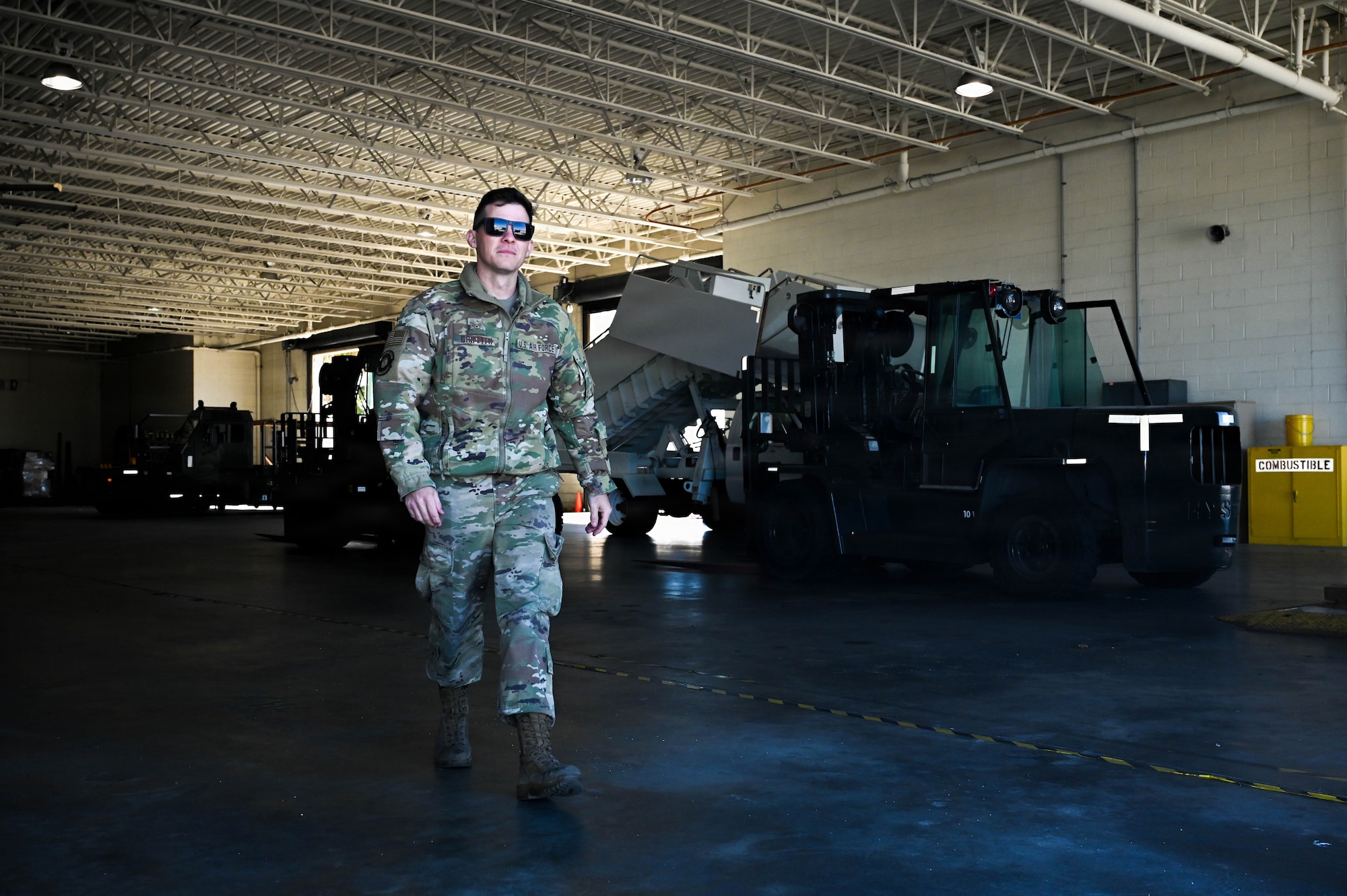 U.S. Air Force Staff Sgt. Joseph Griffith, 45th Logistics Readiness Squadron air terminal operations supervisor walks through a warehouse at Patrick Space Force Base, Florida, Jan. 28, 2026. warehouse inspections help ensure facilities and equipment are ready to support logistics and air terminal operations. (U.S. Space Force photo by Staff Sgt. Samuel Becker)